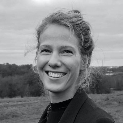 Portrætbillede af Stine Kunkel fra NORM, som smiler